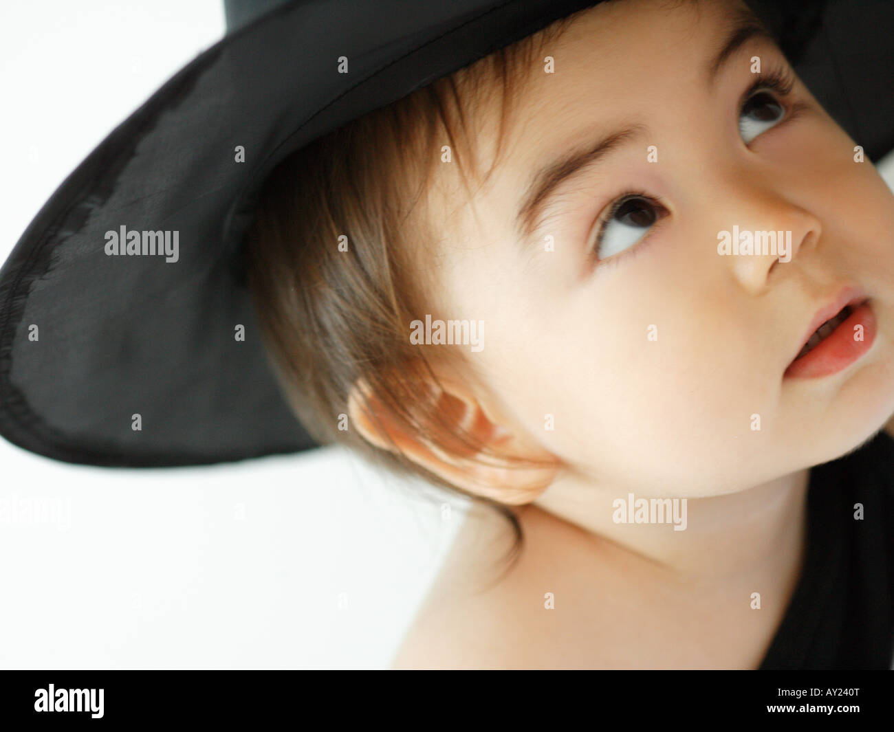 Close-up of a baby girl looking up Stock Photo - Alamy