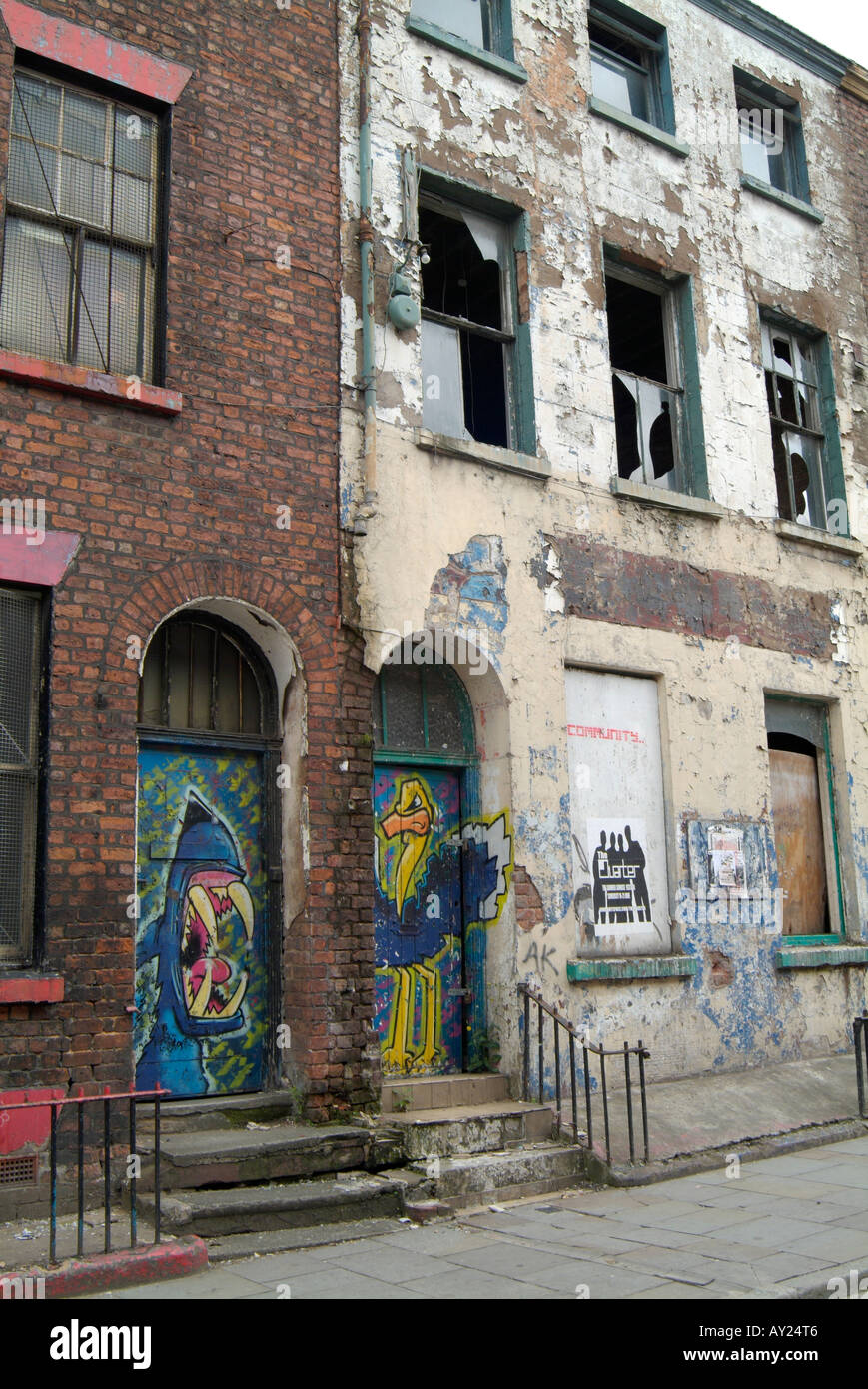 Graffiti on doors of delapidated buildings awaiting refurbishment in