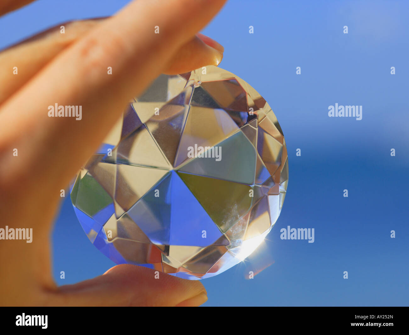 Diamond Hand Catching Close-up of a person's hand holding a diamond Stock Photo - Alamy