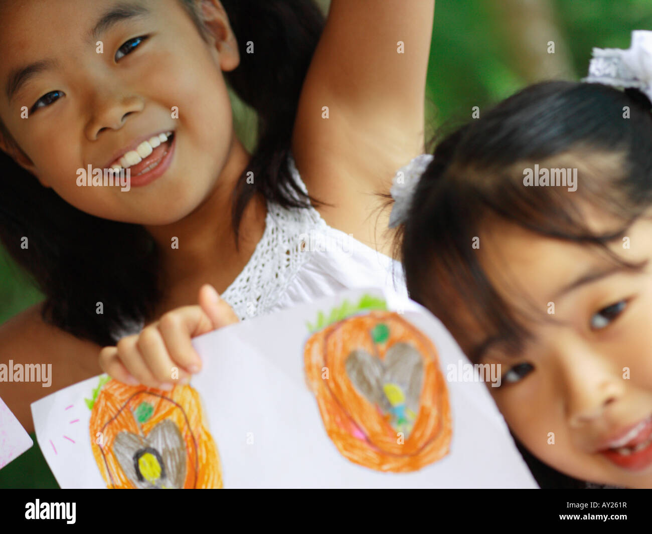 Portrait of two girls smiling Stock Photo - Alamy
