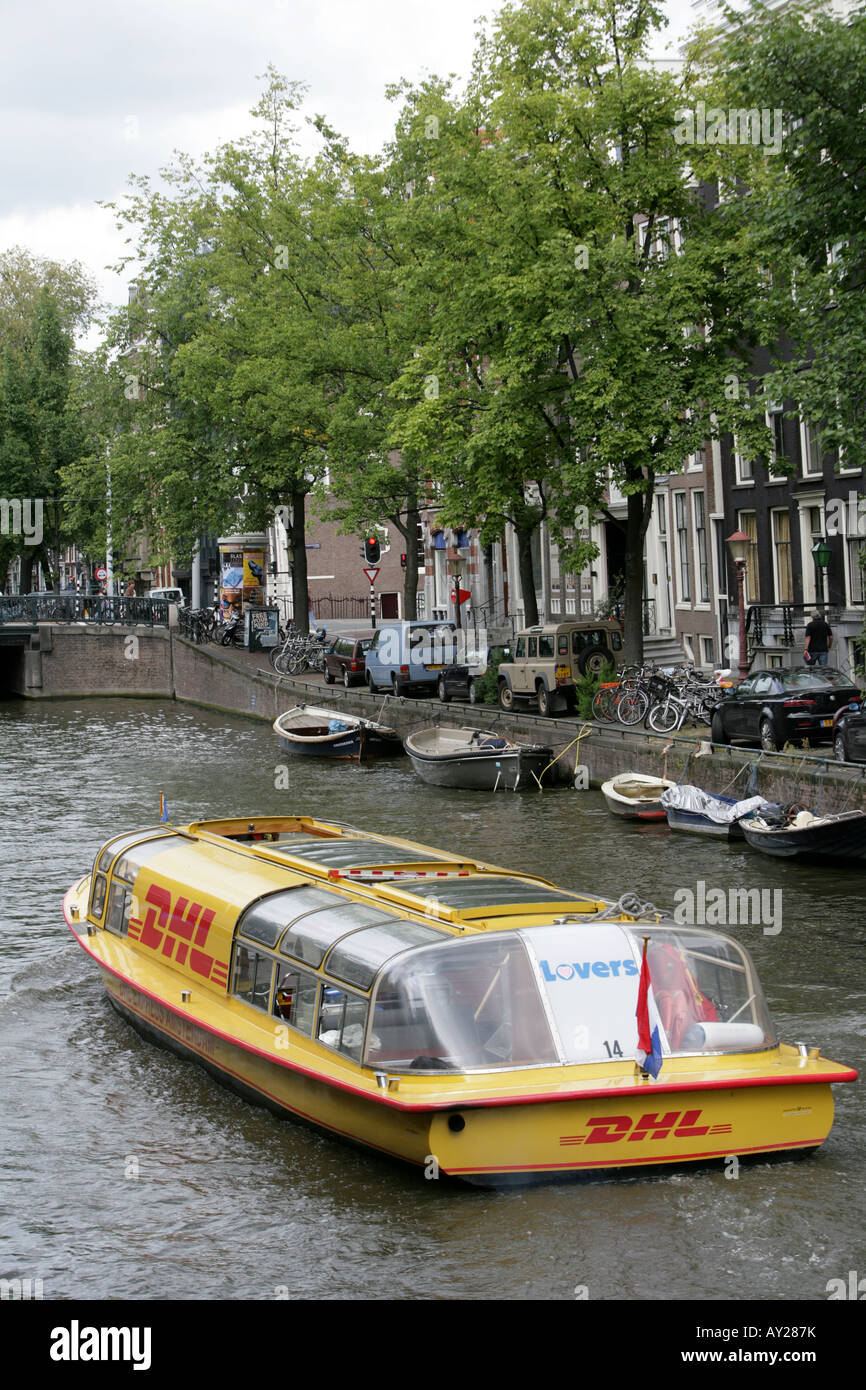 Nld The Netherlands Amsterdam Dhl Canal Boat Stock Photo Alamy
