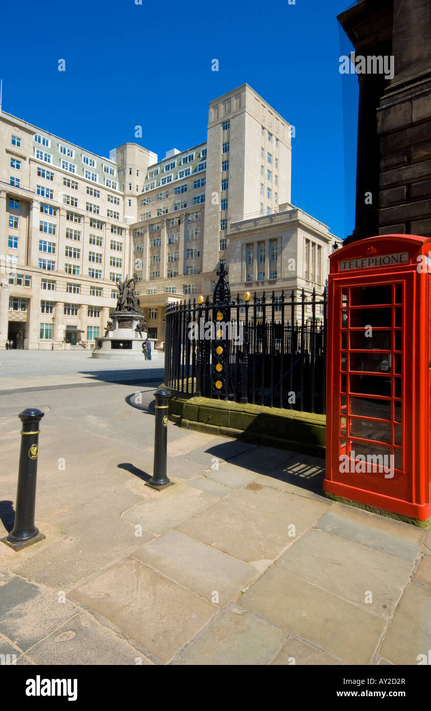 Exchange flags and Horton House Liverpool UK with traditional red public telephone box Stock Photo