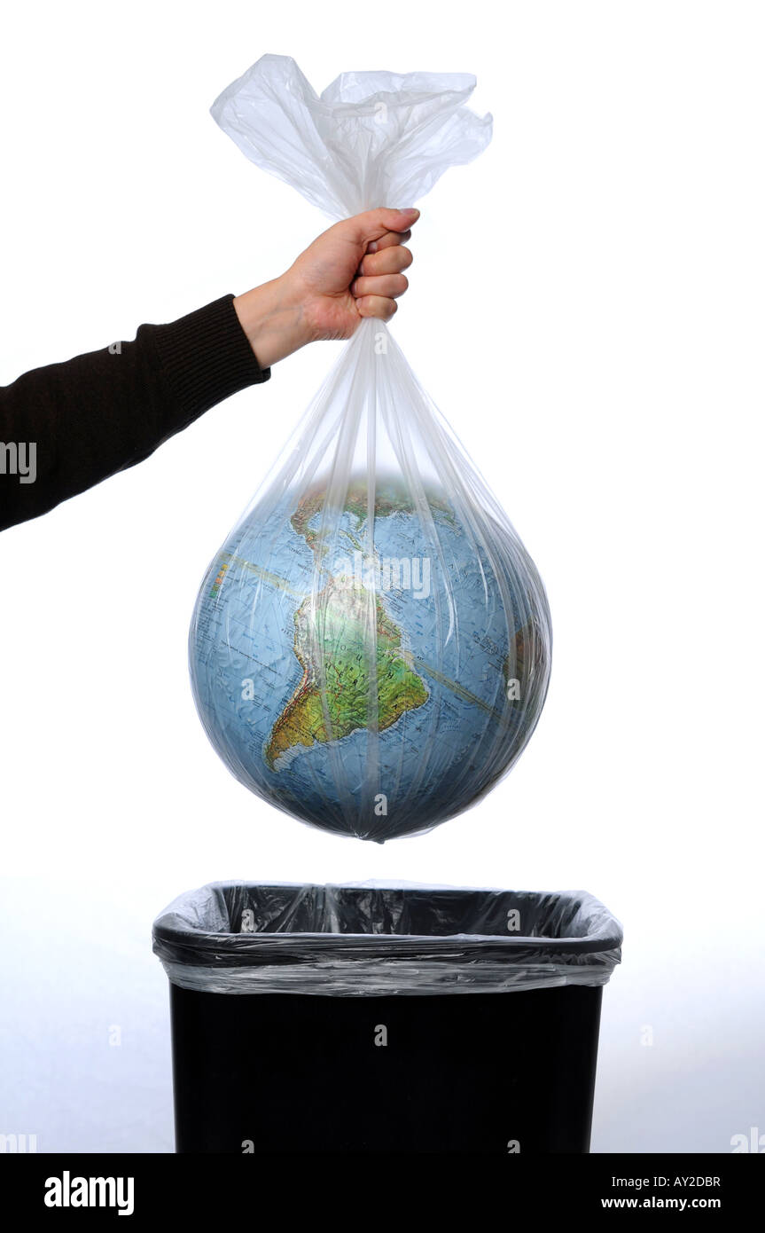 Earth in a trash bag being thrown away Stock Photo Alamy