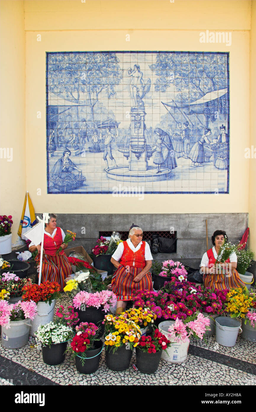 Flower sellers in traditional costume outside the Mercado dos Lavradores Funchal Madeira Portugal Stock Photo