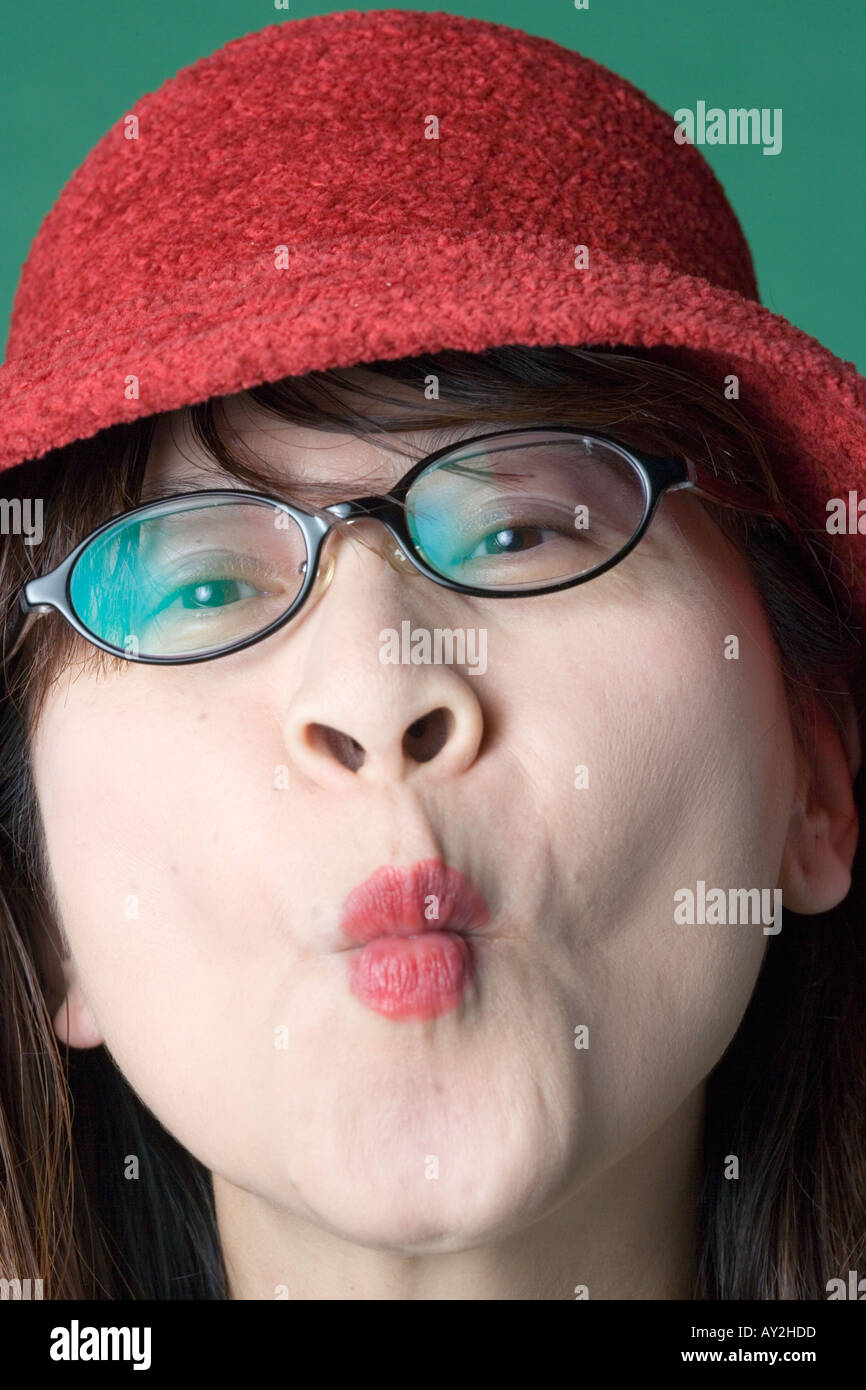 Portrait Asian American woman making fish face Stock Photo - Alamy