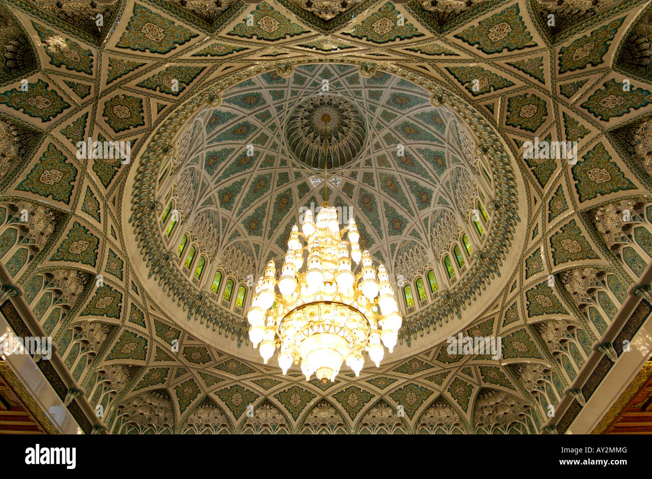 Chandelier and interior of the dome over the prayer area of the Sultan Qaboos Grand Mosque in Muscat, the capital of Oman. Stock Photo