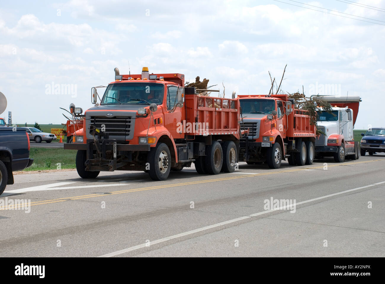 Dump trucks hauling debris from Greensburg Kansas following a powerful tornado Stock Photo