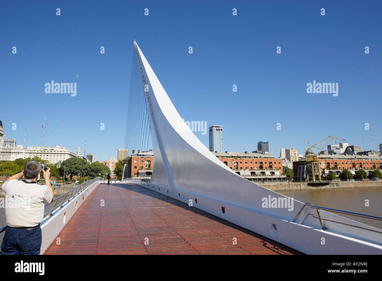 Man taking pic of Bridge Puente de la Mujer Peatonal in Puerto Madero Buenos Aires Argentina South America Stock Photo