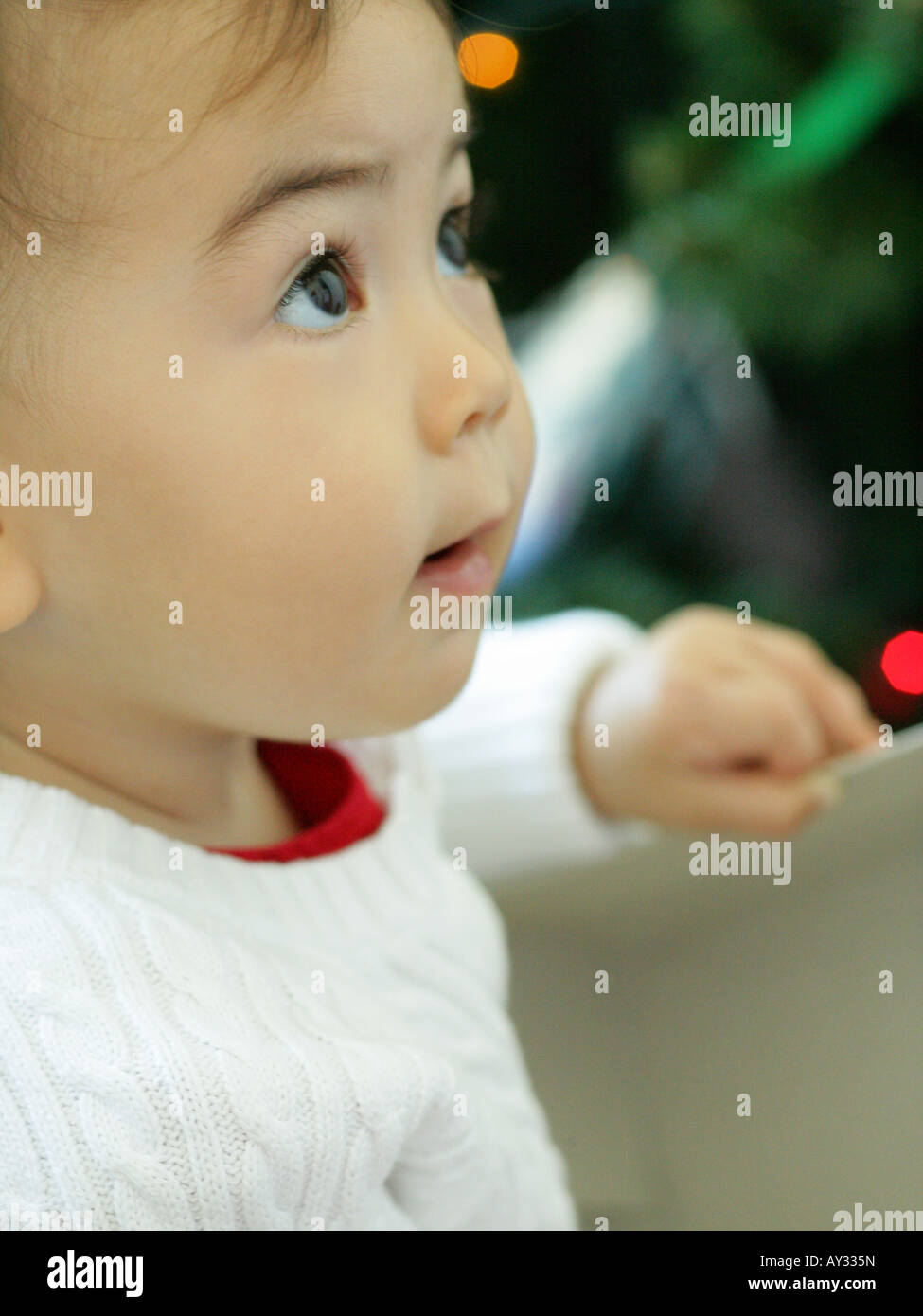 Side profile of a baby girl looking up Stock Photo - Alamy