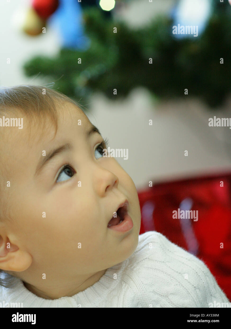 Close-up of a baby girl looking up Stock Photo - Alamy