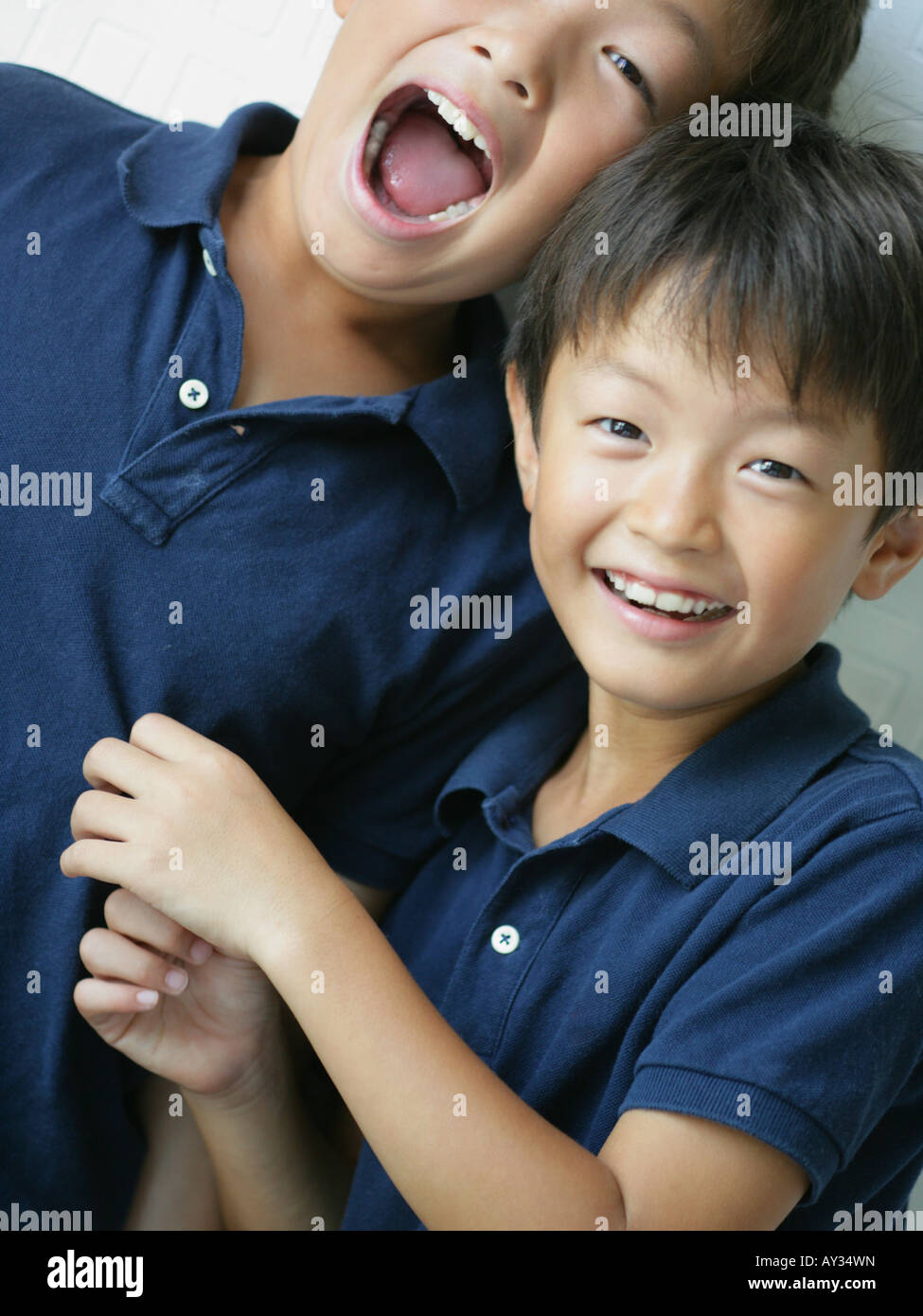 Portrait of two boys smiling Stock Photo - Alamy