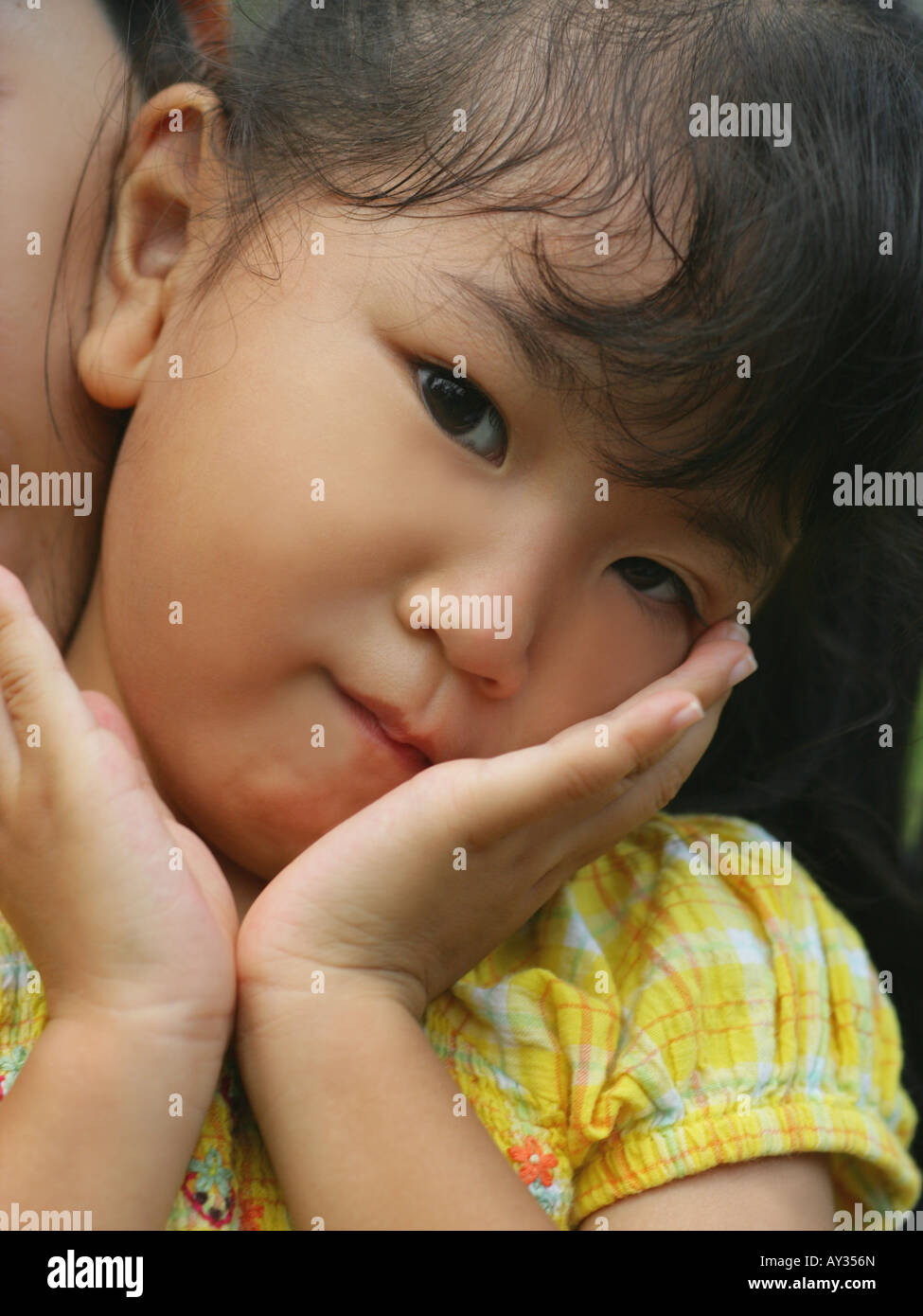 Asian girl hand on chin hi-res stock photography and images - Alamy