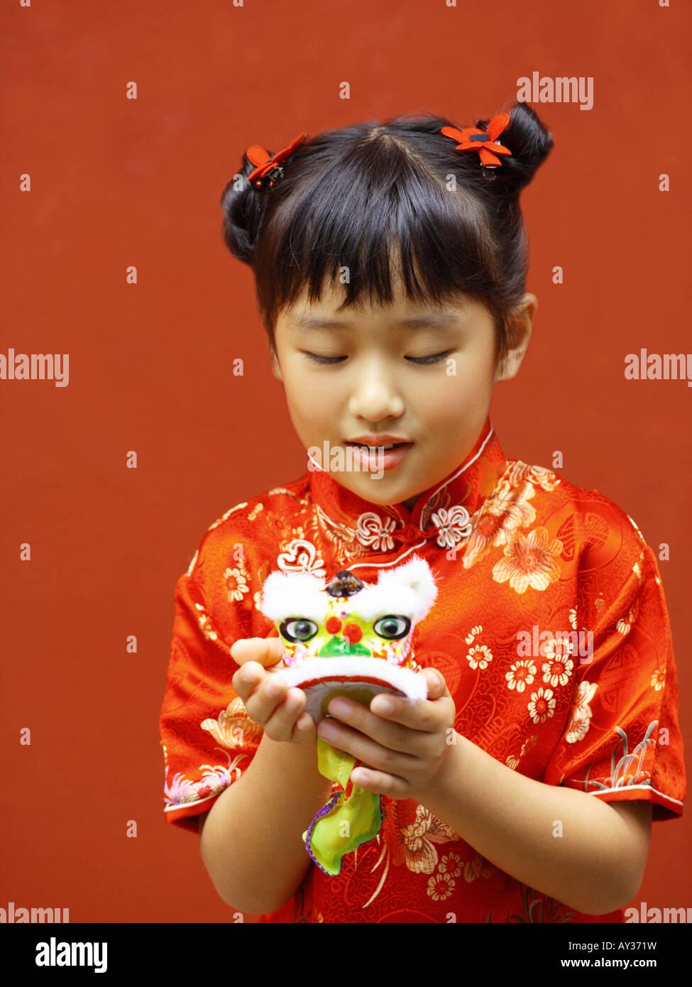 Close-up of a girl holding a toy Stock Photo
