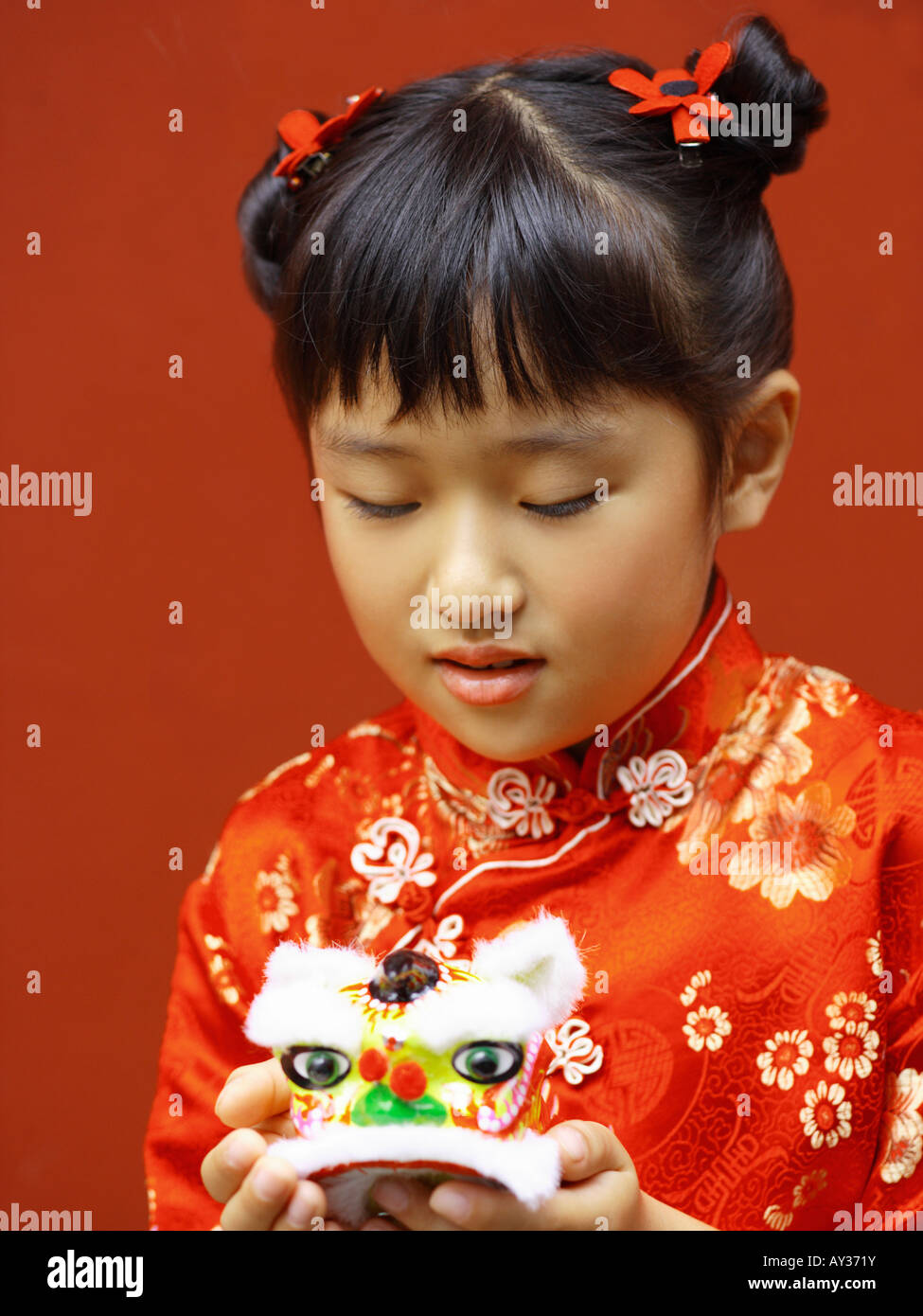 Close-up of a girl holding a toy Stock Photo