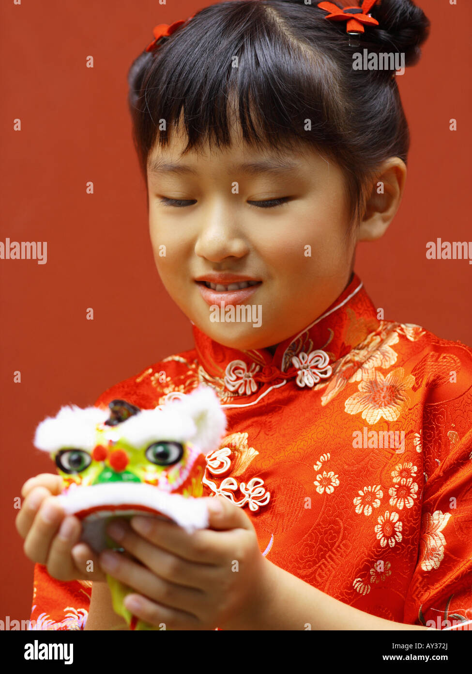 Close-up of a girl holding a toy Stock Photo