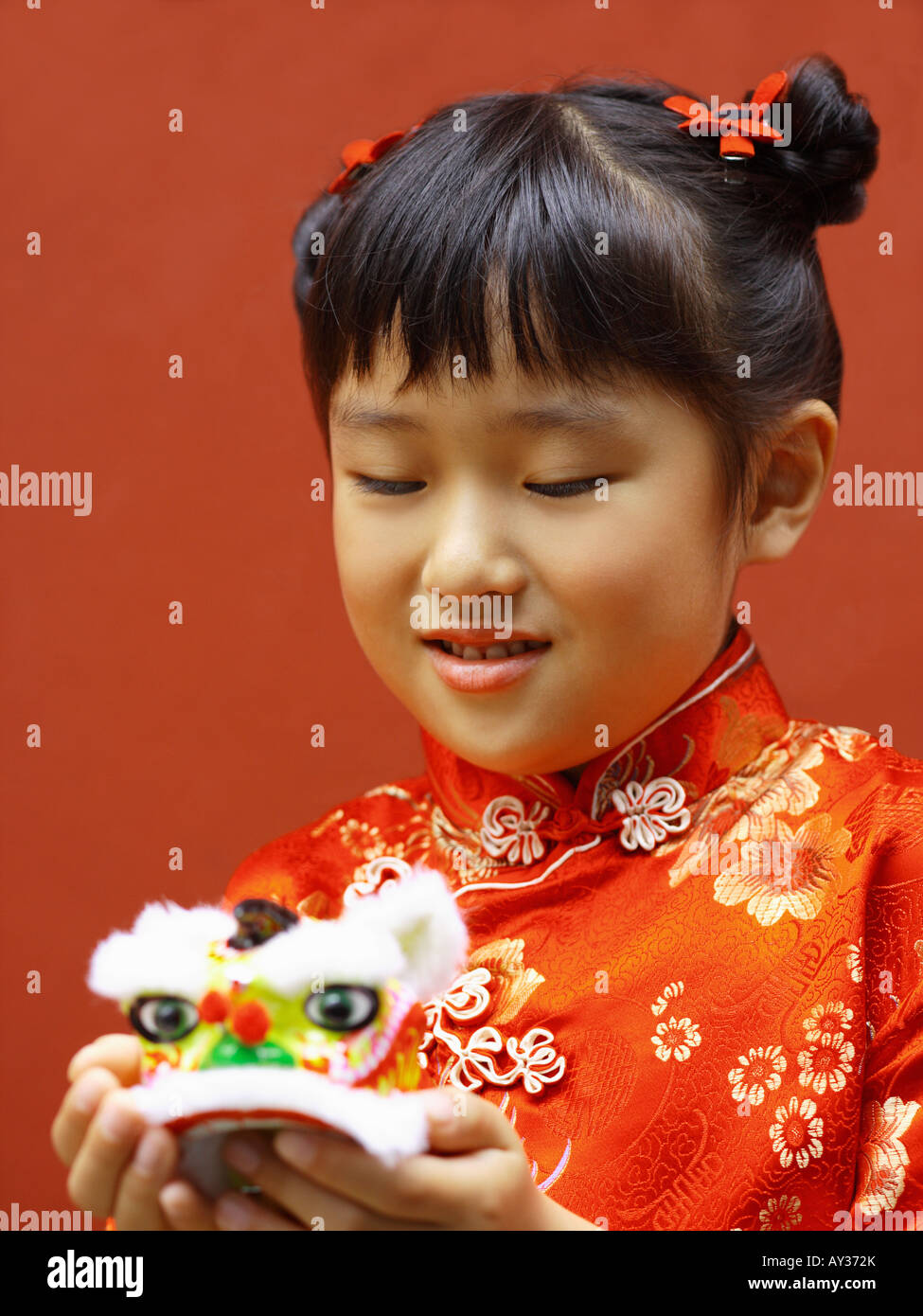 Close-up of a girl holding a toy Stock Photo