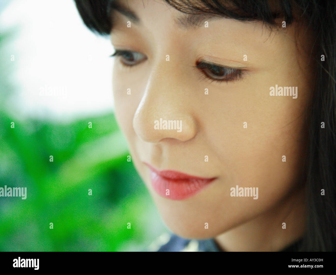 Woman close up looking down hi-res stock photography and images - Alamy