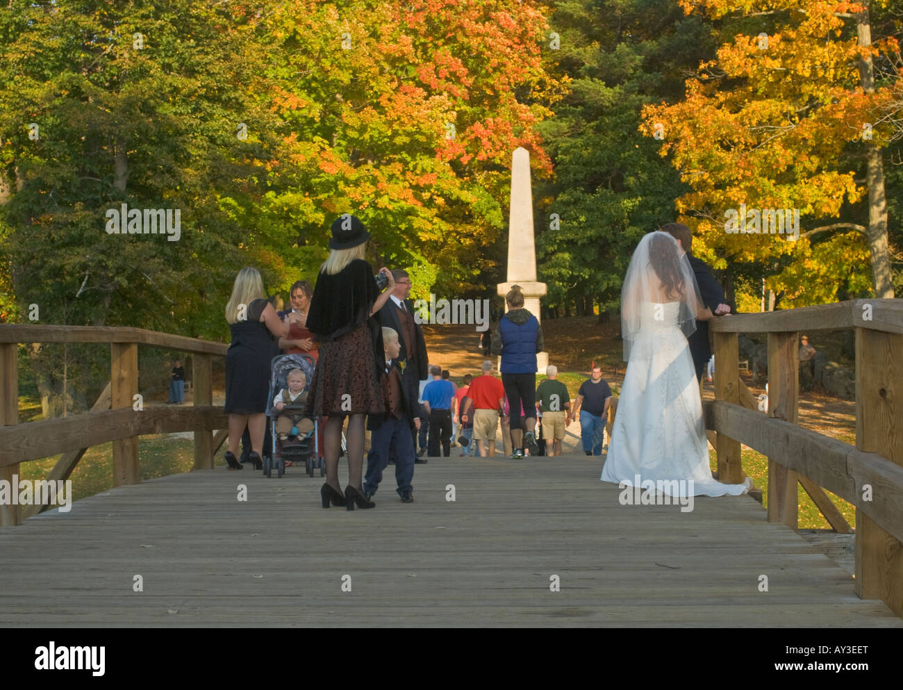 Bride and wedding guests on Old North Bridge Concord, MA Stock Photo