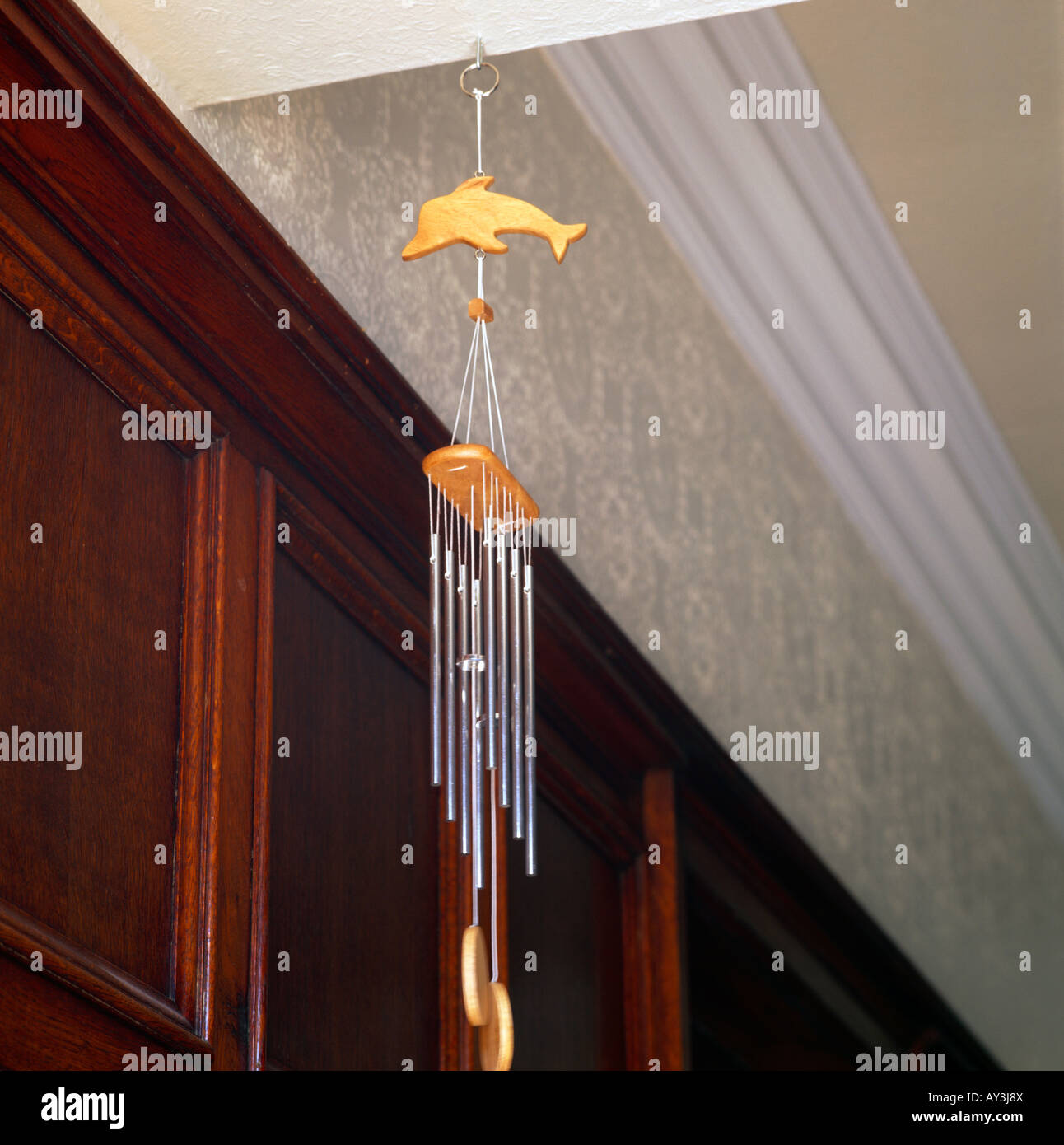 Feng Shui Wind Chimes In Hallway Wooden Panelling Clearing Space Stock