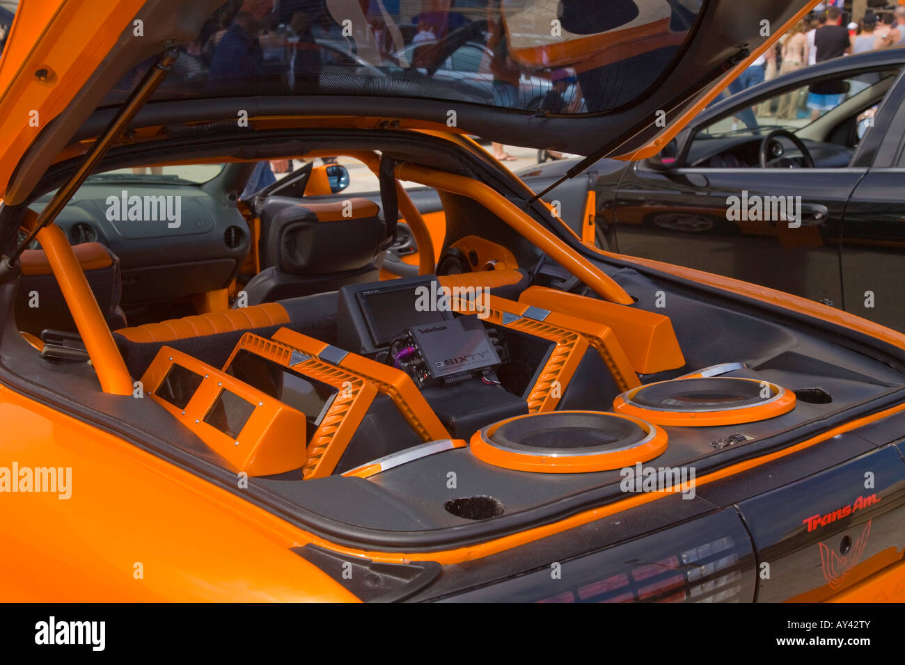 Car show at Daytona Beach of modified cars with large stereo car