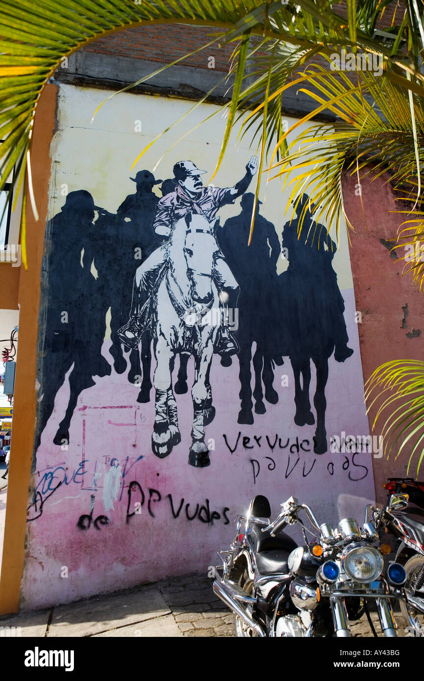 Outdoor wall mural depicting Daniel Ortega leading Sandinistas on horseback Esteli Nicaragua Stock Photo
