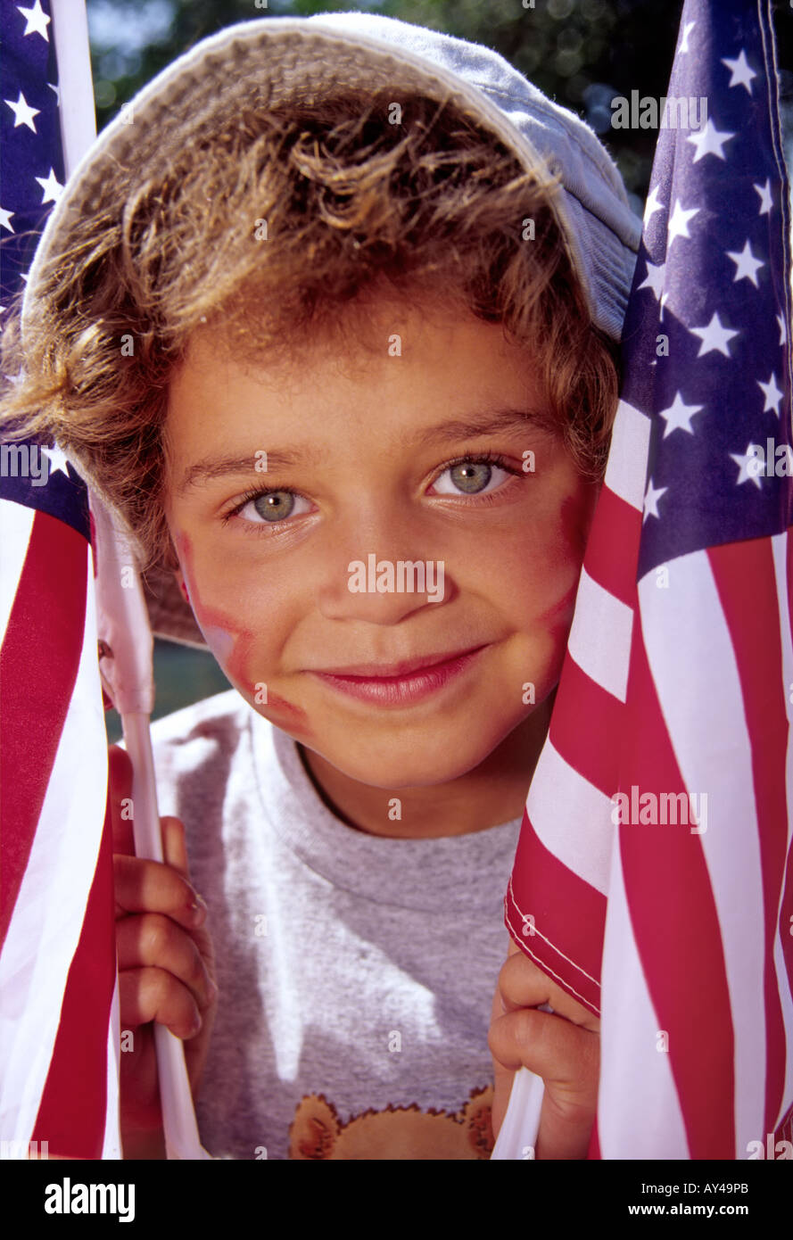 MR 618 A patriotic Emily Dirk waves American flags in the 4th of July