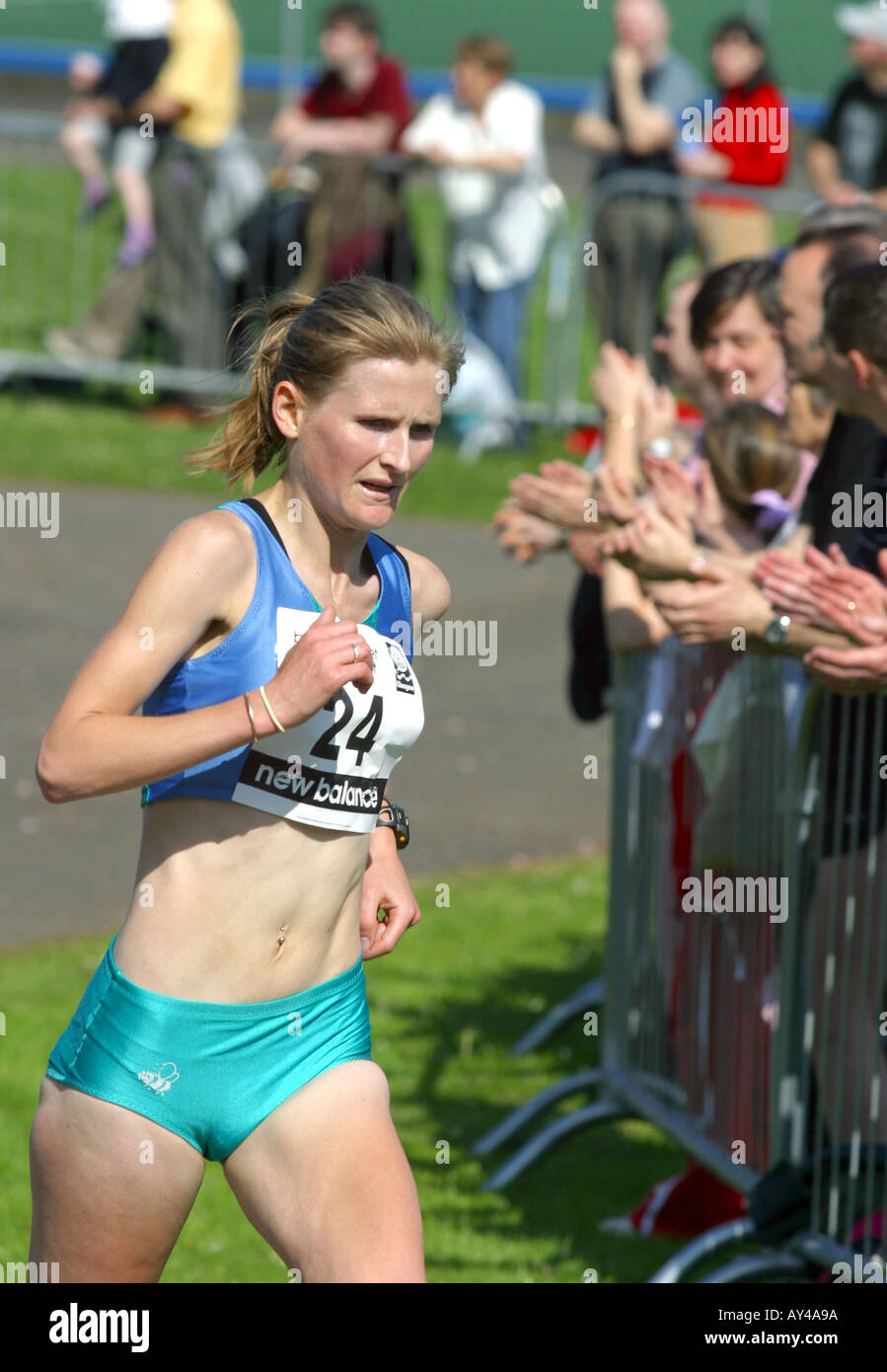 Women runner competing in road race Stock Photo