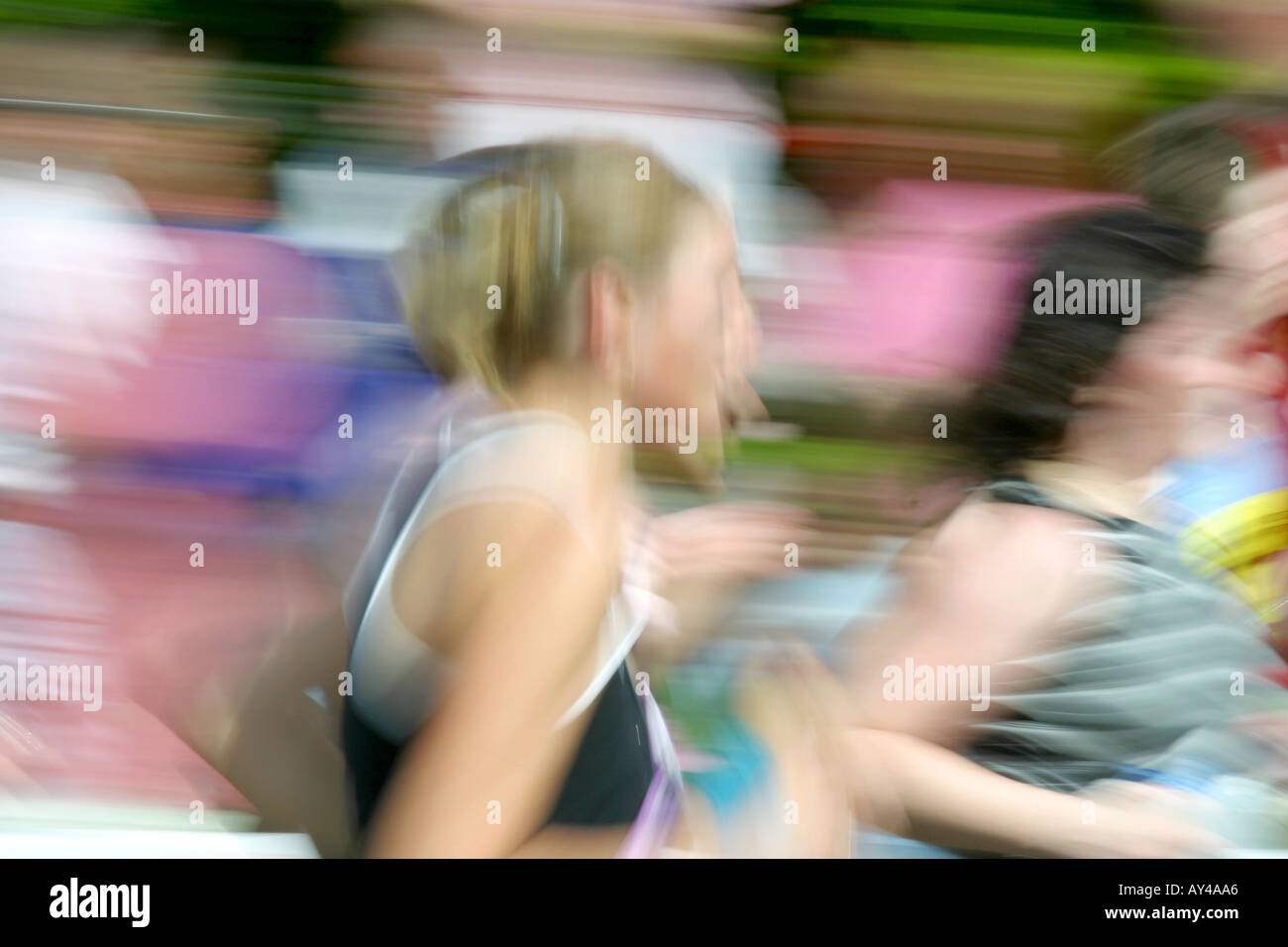 Women runners competing in road race Stock Photo