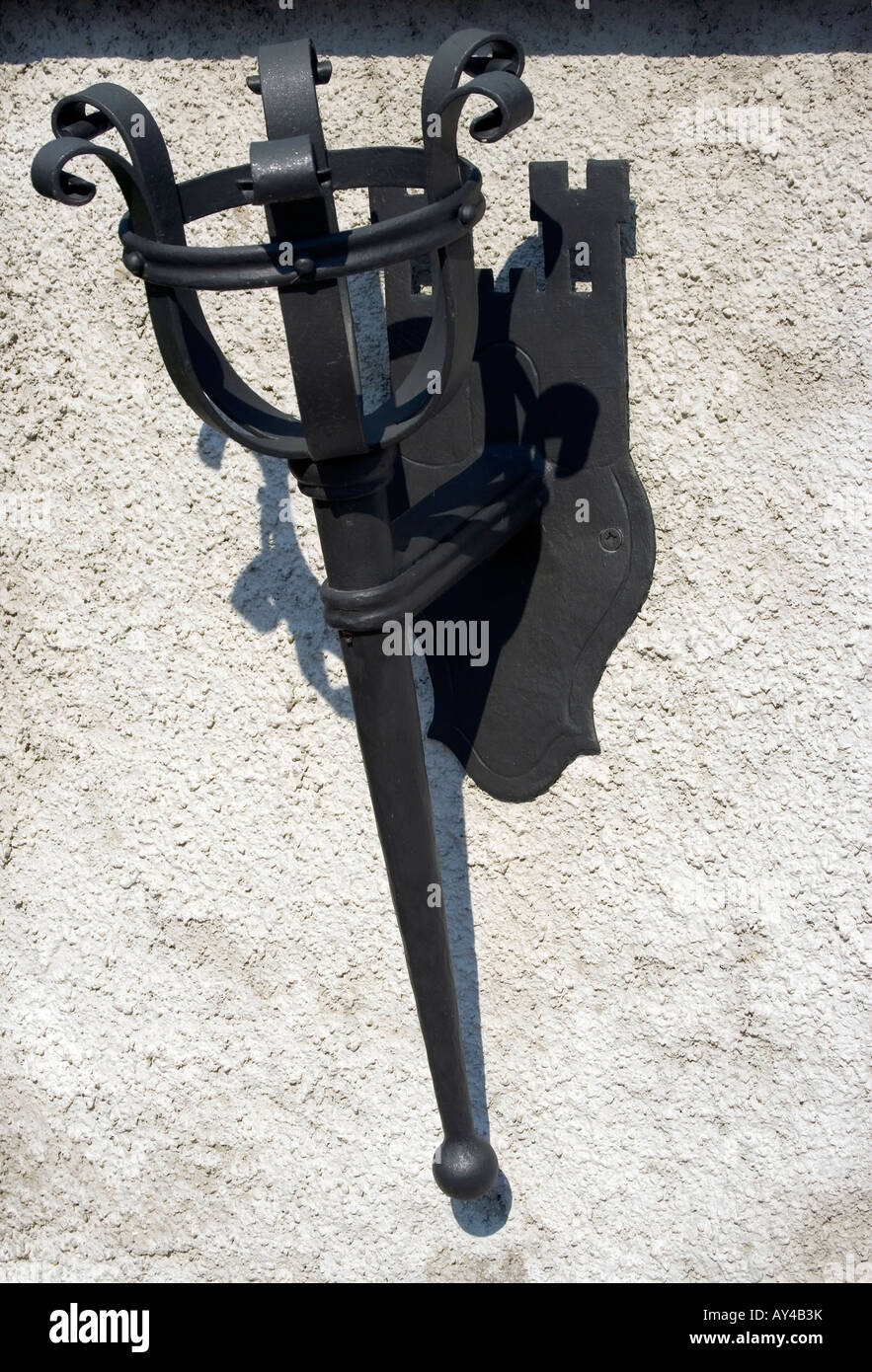 Outdoor, old style fire lamp stand, mounted on the wall. Stock Photo