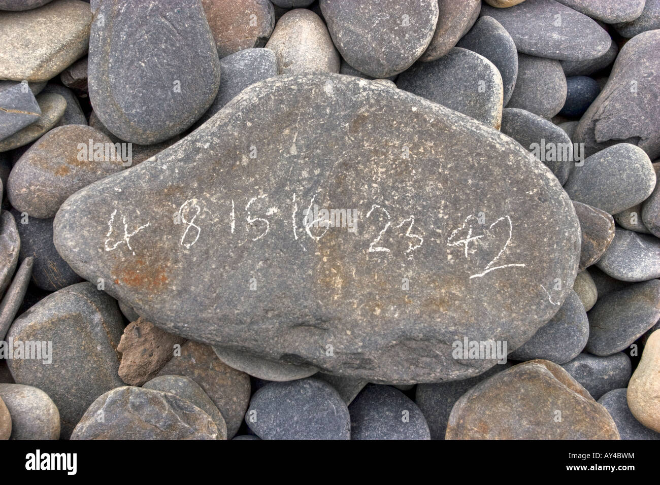 Sequence of lottery numbers scratched on stone Stock Photo Alamy