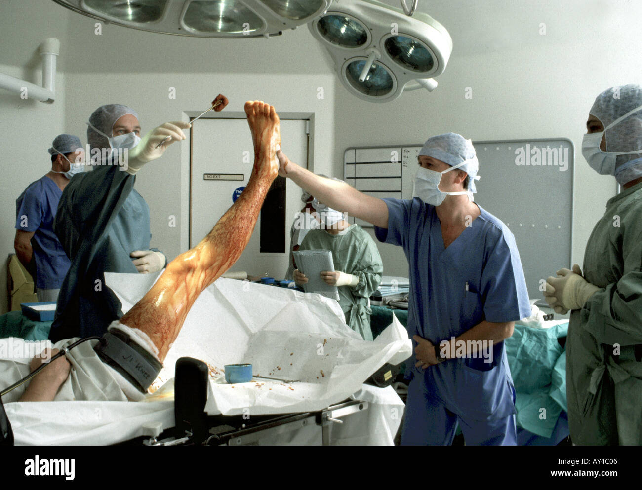 Surgeon preparing patient for knee surgery using iodine Stock Photo Alamy