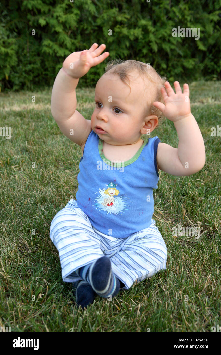 Child with hands up Stock Photo - Alamy