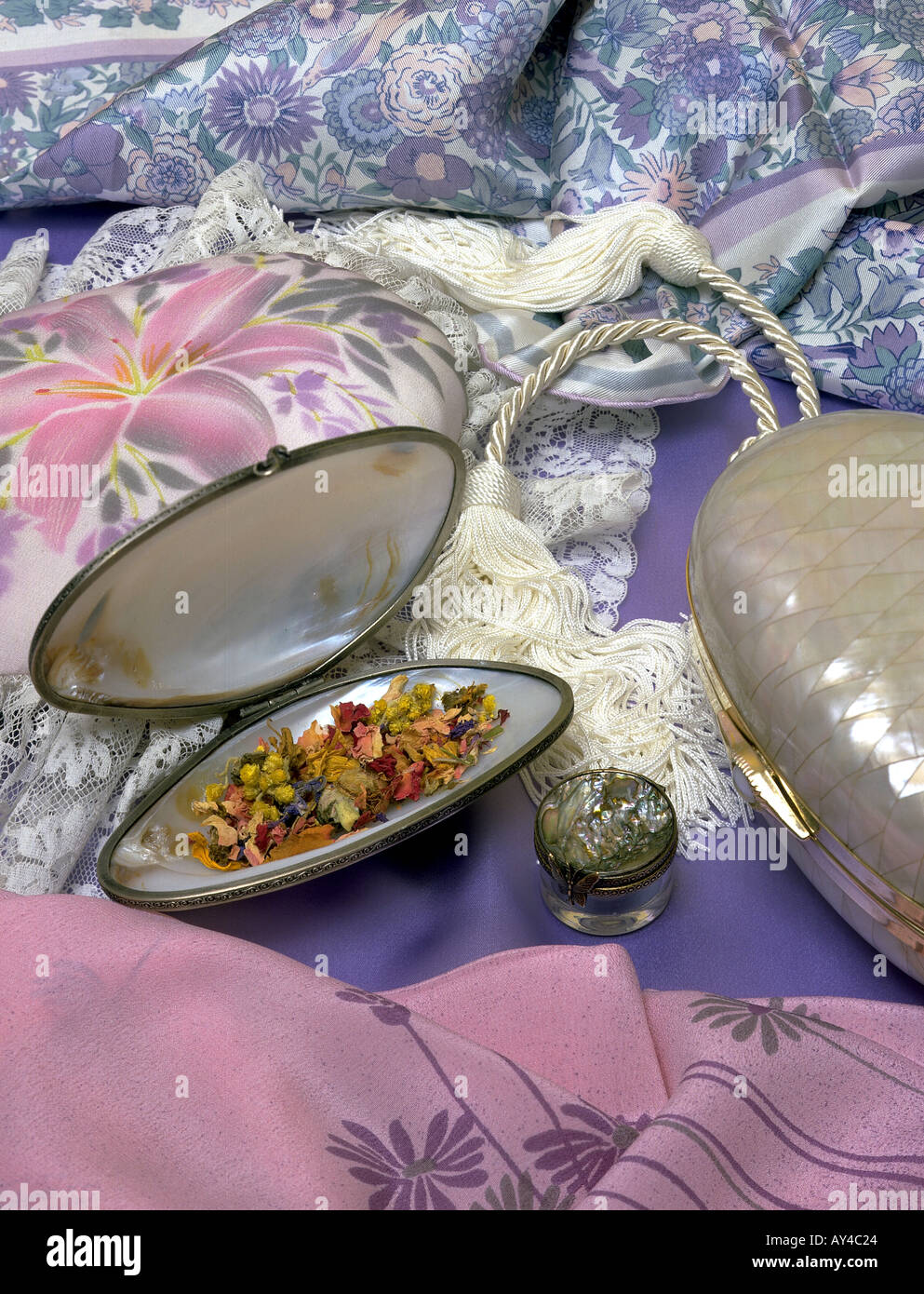 Pot pouri in shell shaped box on silks Stock Photo