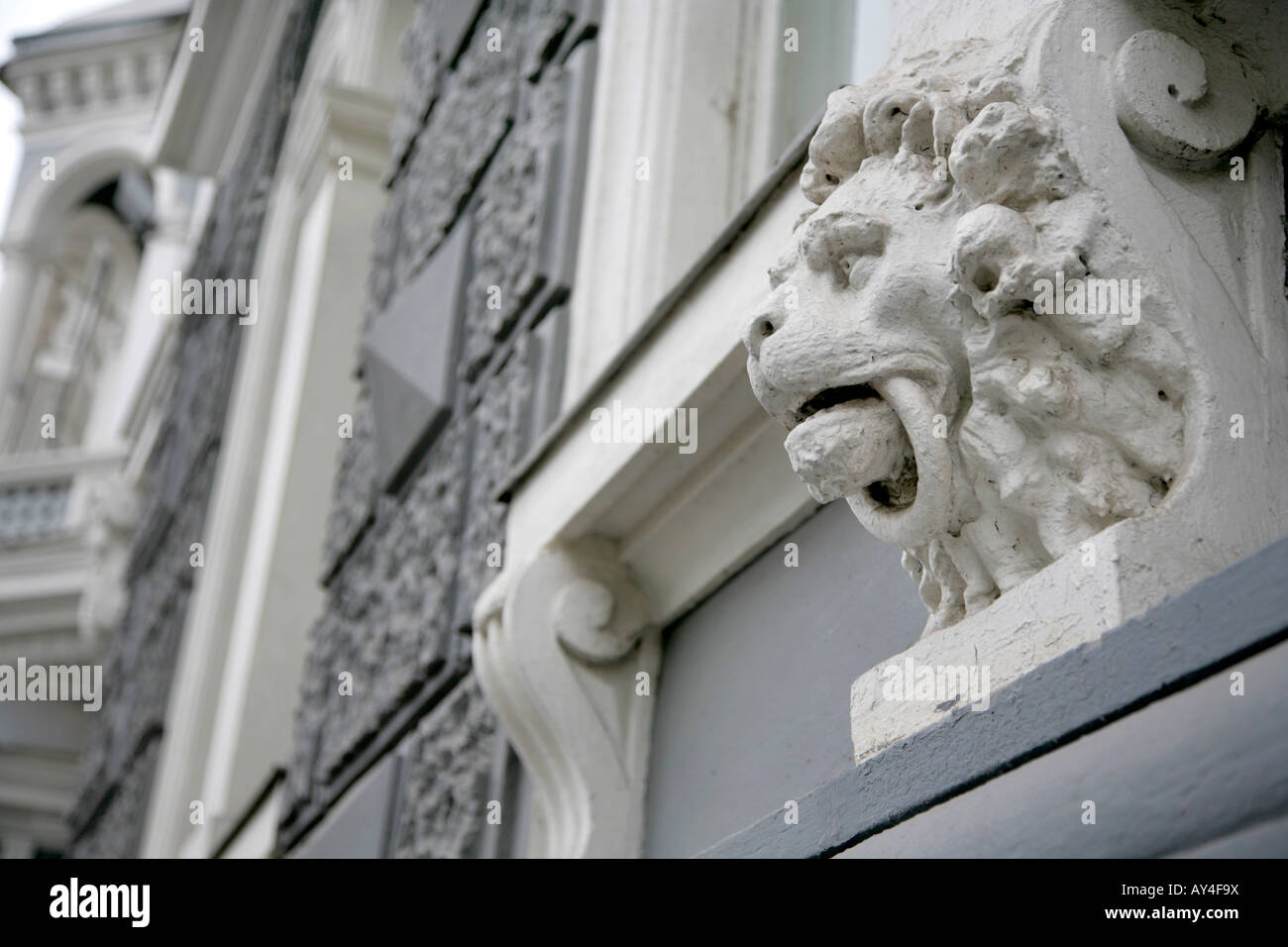 Detail of carving of Lion's head under window on stone building in Odessa, Ukraine. Stock Photo
