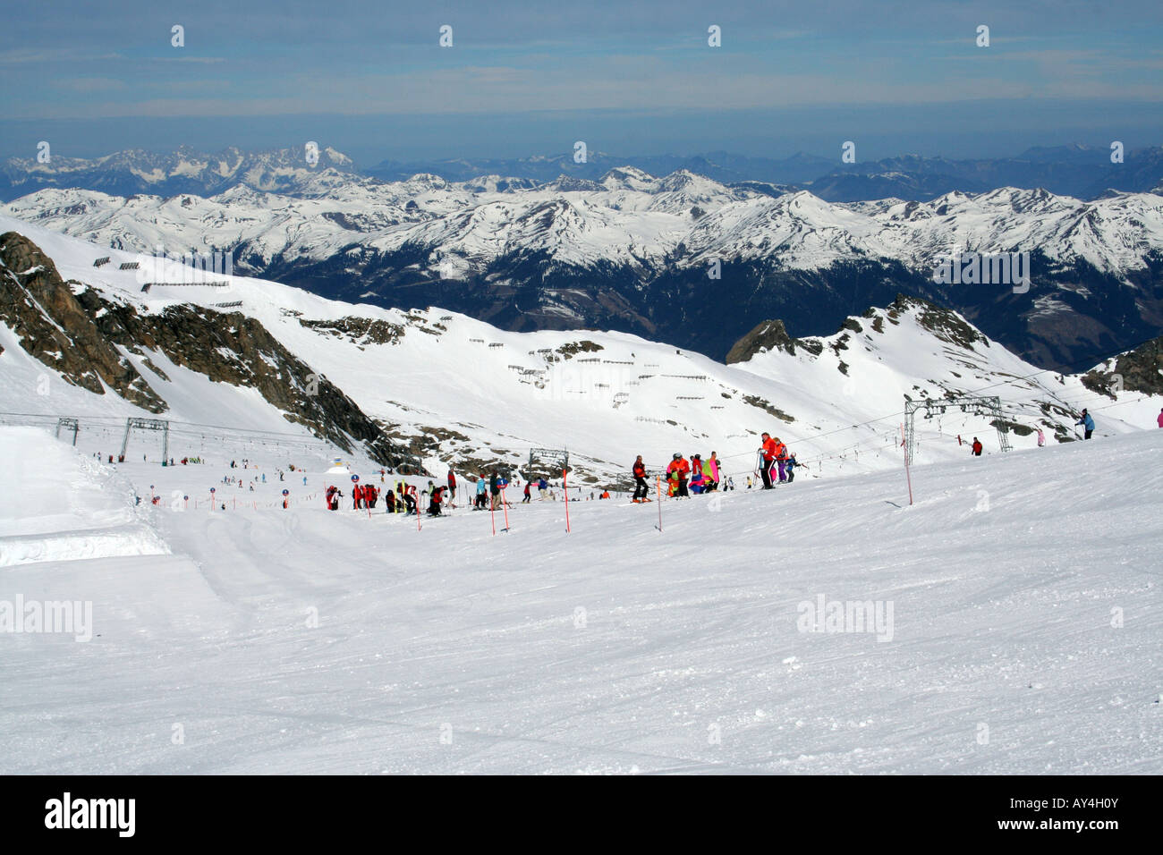 Skiers on snow covered slopes in winter resort of Crans Montana, Switzlerland. Stock Photo