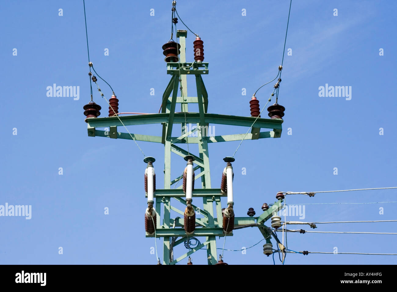 Electric power lines over clear blue sky Stock Photo - Alamy