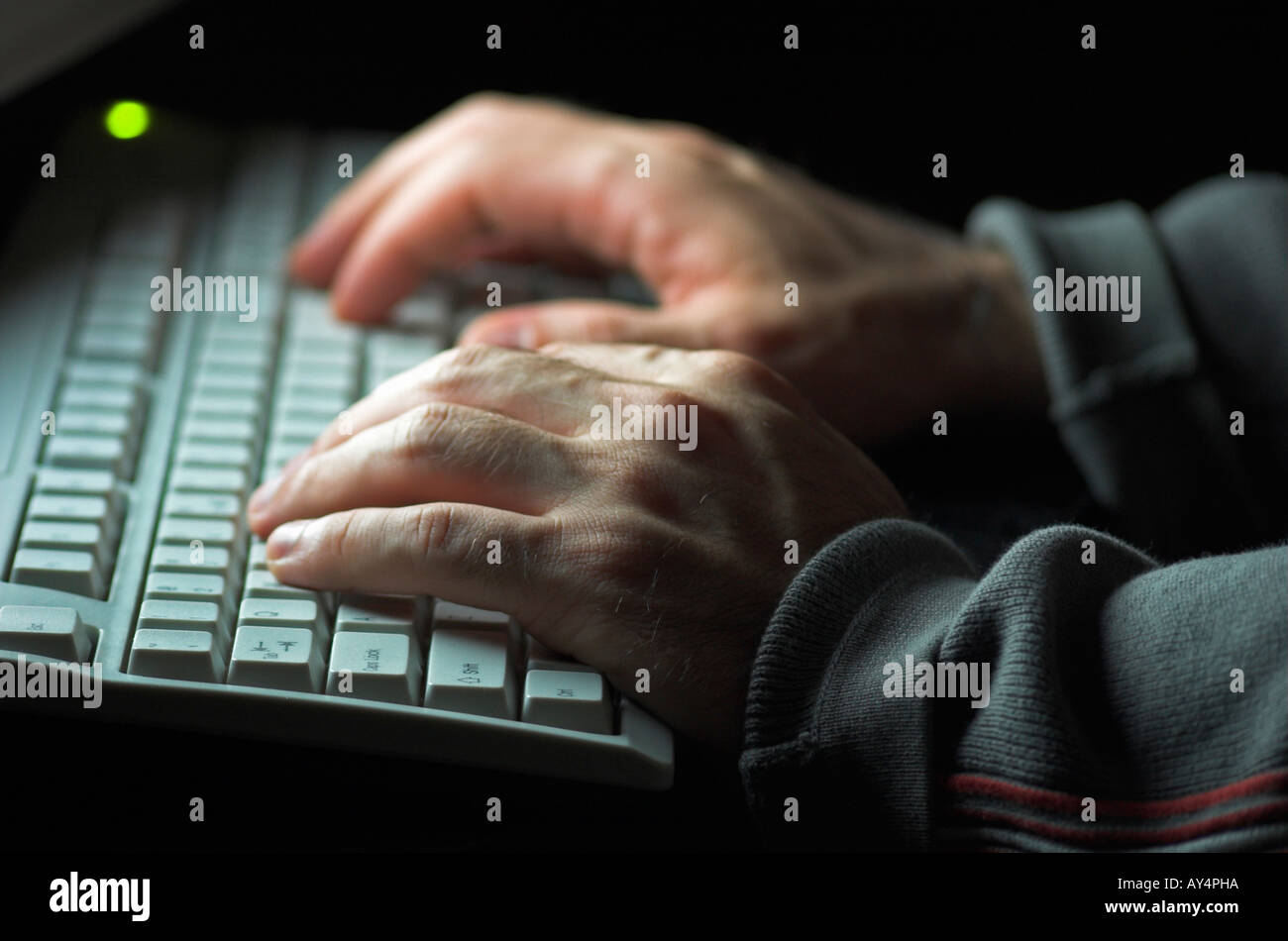 Using Computer Hands Picture Hands illuminated hi-res stock photography and images - Alamy