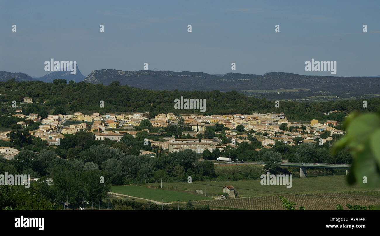Sommieres in Languedoc Spreads Across a Valley Below the Distinctive Mountain Le Pic St Loup Stock Photo