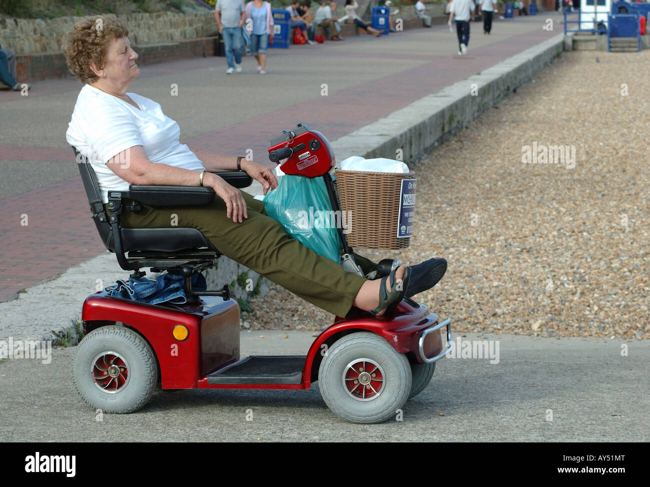 Elderly Woman On Mobility Scooter High Resolution Stock Photography and