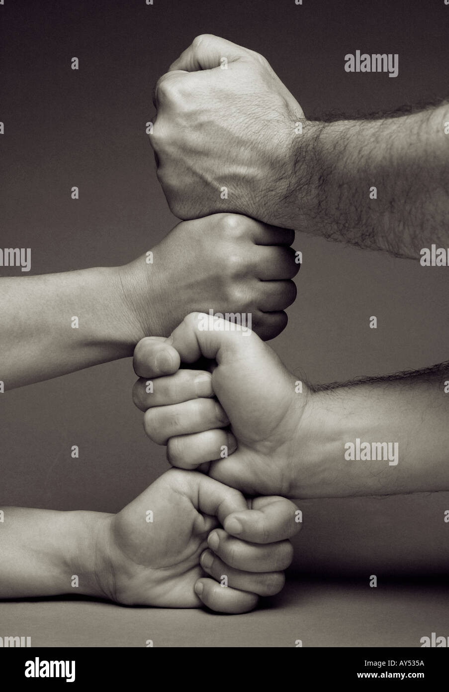 GROUP OF PEOPLE TEAM RESTING HAND ON TOP OF ANOTHERS. Stock Photo