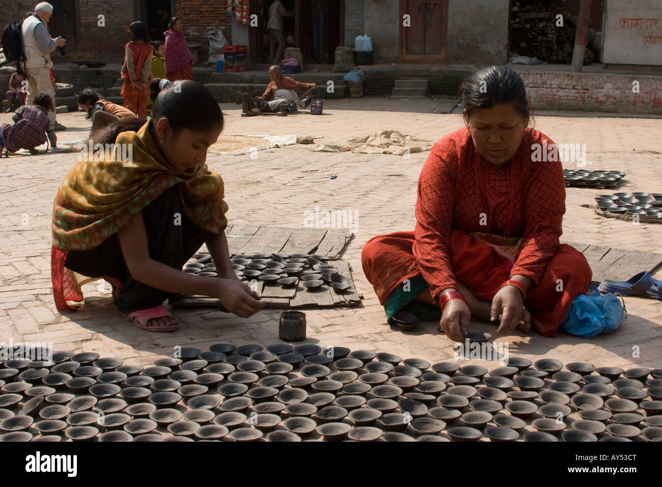 Nepalese women making earthen candle holders in Kathmandu Nepal Stock