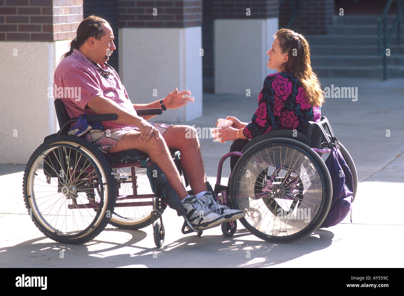 Handicapped woman and man conversing  Stock Photo