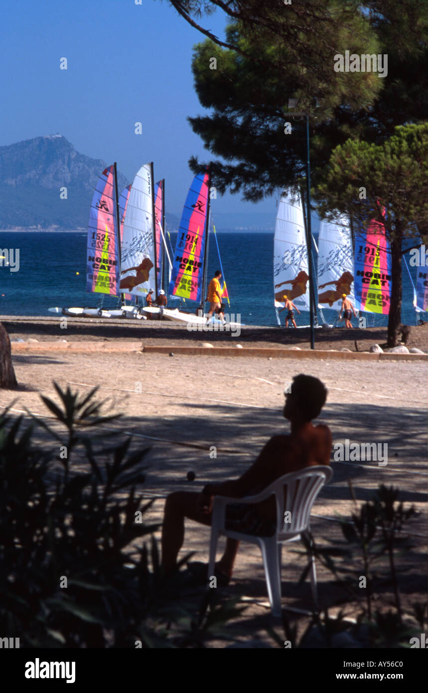 shady spot on the beach and sailing boats on beach. Mediterranean sea, Turkey. Stock Photo