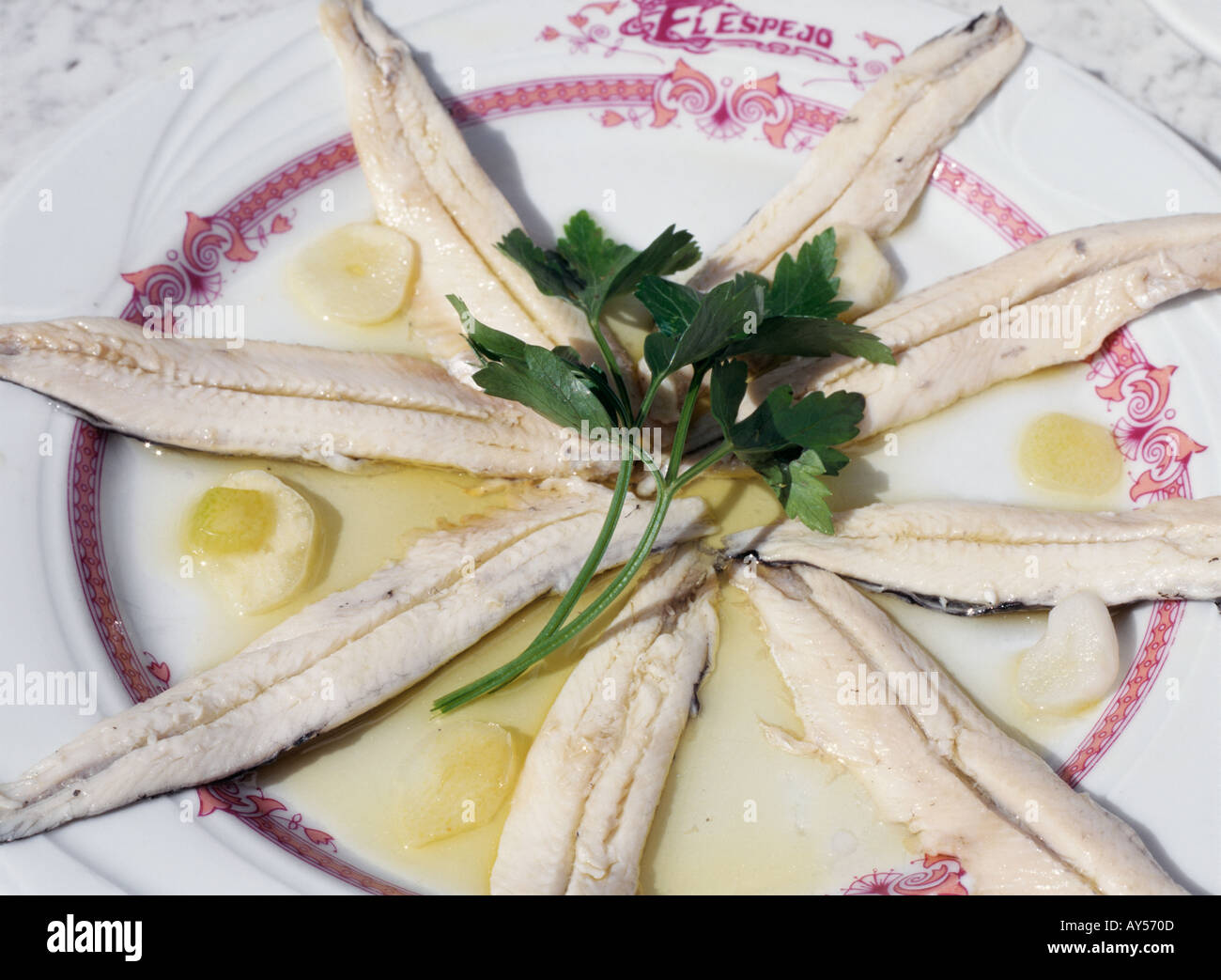 Spanish fish Tapas Marinated anchovies Boquerones en vinagre Andalucian Andalusian gastronomy Spain Madrid Stock Photo