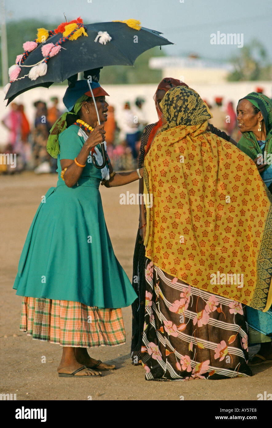 A decorated umbrella is a parasol as Muslim women chat in Djibouti Stock  Photo - Alamy