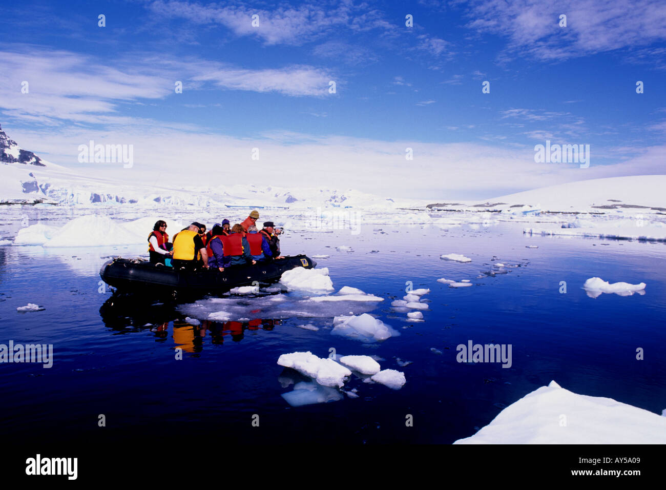 Tourist on Zodiac with Glaciers at Prospect Point Antarctica Stock