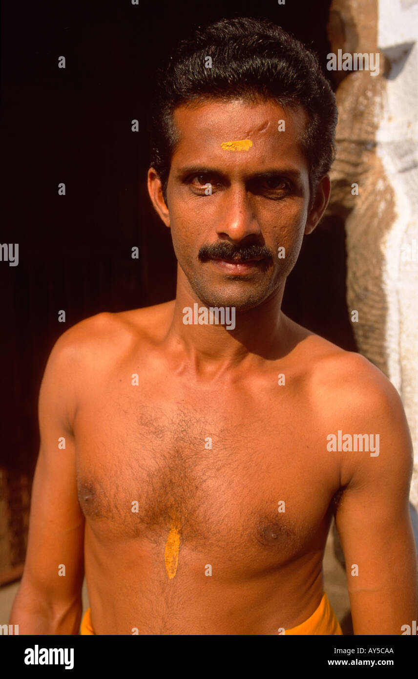 Barechested temple doorman guarding the entrance to Sri Padmanabhaswamy Vishnu Temple