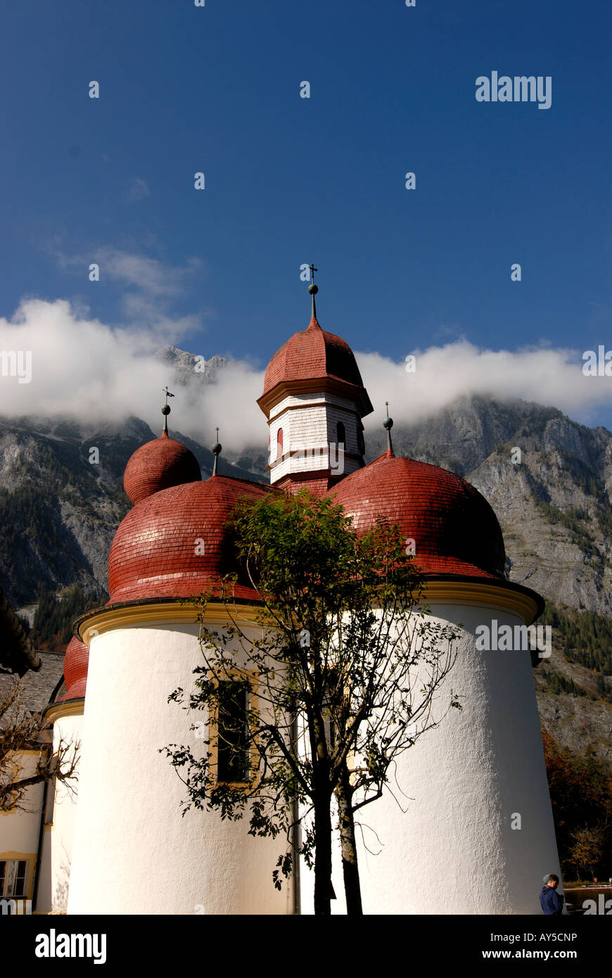 The very famous St Bartholomä church on the Königssee in the background the Watzman Berchtesgadener land National park Bavaria Stock Photo