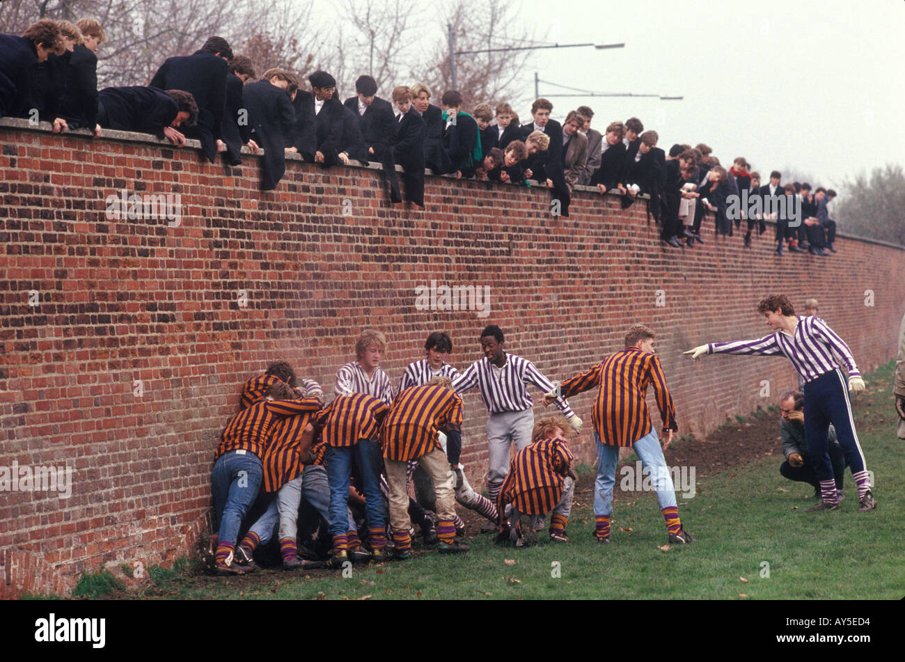 Eton College school Oppidans (back) Collegers (facing) Eton Wall Game, played November annually. Windsor Berkshire 1985 1980s UK HOMER SYKES Stock Photo