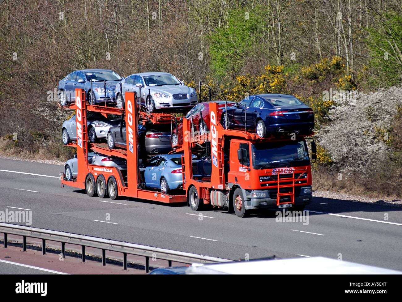 MCD car transporter carrying new Jaguar cars on M40 motorway, Warwickshire, UK Stock Photo